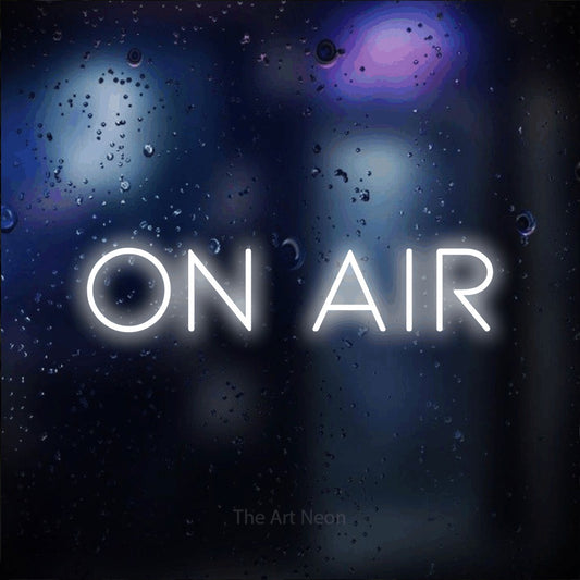 Cool white LED neon sign reading "On Air" against a dark blue bokeh background for gaming room décor