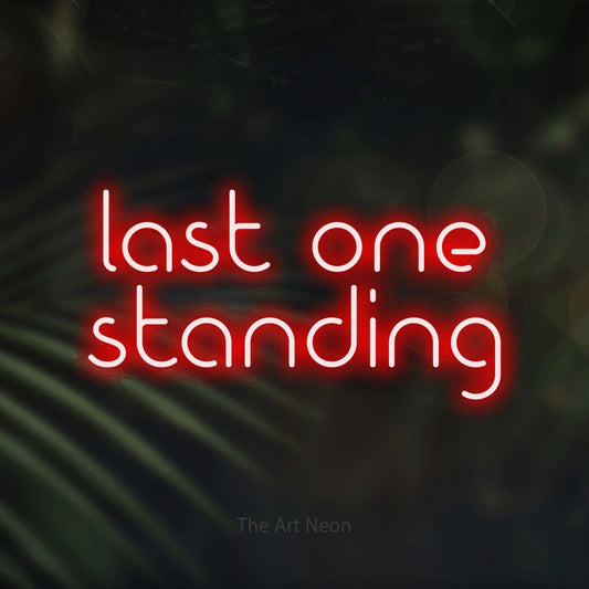 Red LED neon sign reading "Last One Standing" against dark blurred palm leaves for gaming room décor