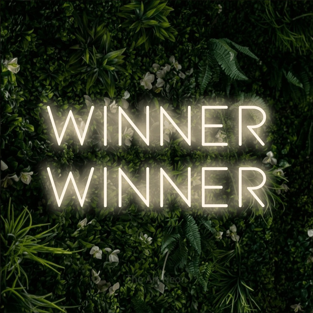 Warm white LED neon sign reading "Winner Winner" against a leafy green wall for gaming room décor