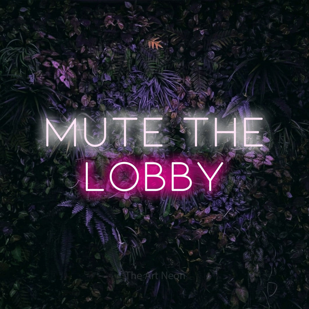 Hot pink and cool white LED neon sign reading "Mute the Lobby" against a purple floral wall for gaming room décor