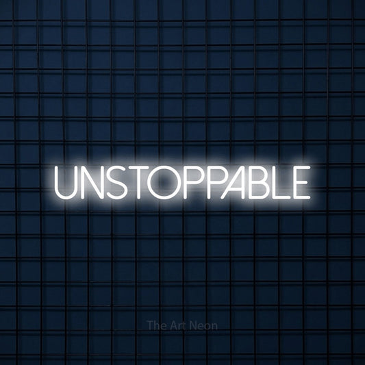 Cool white LED neon sign reading "Unstoppable" against a dark blue tiled wall