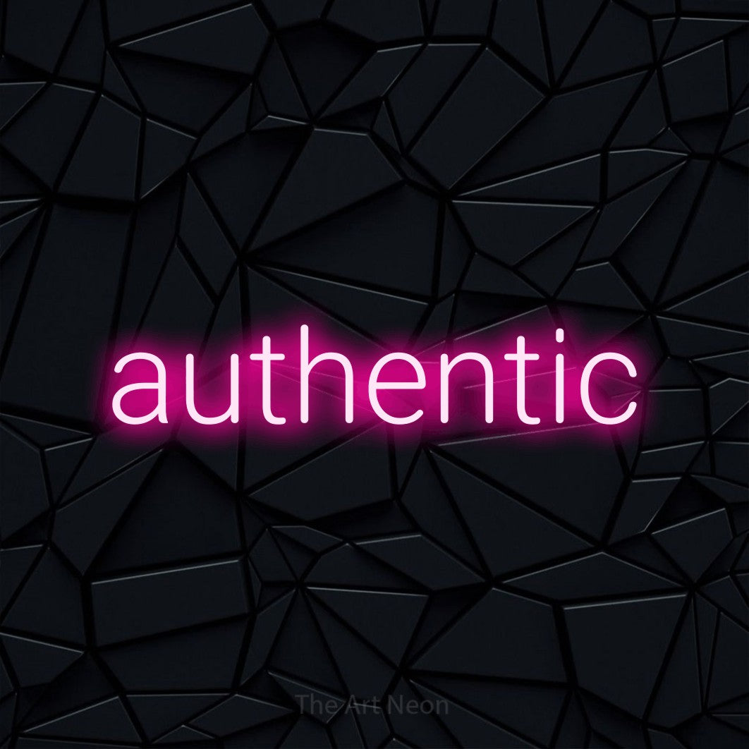 Hot pink LED neon sign reading "Authentic" against a black faceted wall