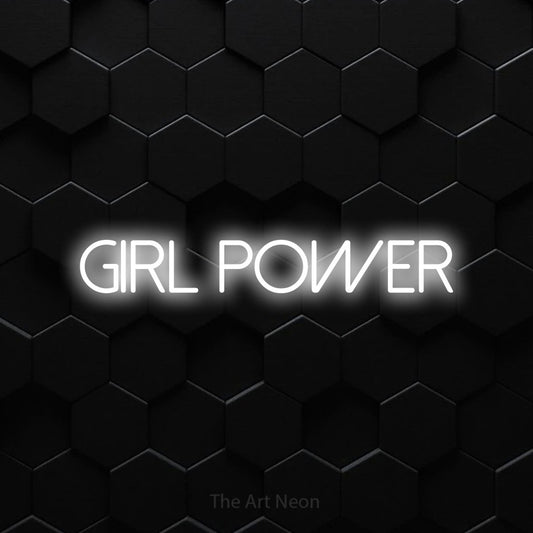 Cool white LED neon sign reading "Girl Power" against a black hexagonal wall