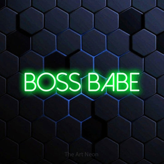 Green LED neon sign reading "Boss Babe" against a blue hexagonal wall