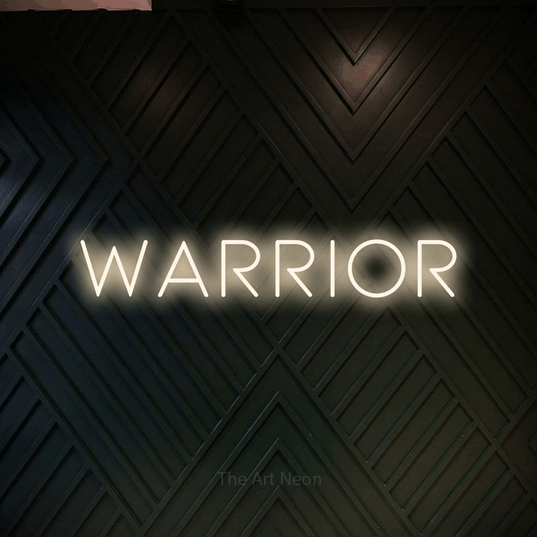 Warm white LED neon sign reading "Warrior" against a dark geometric wood wall