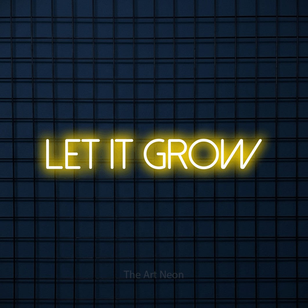 Yellow LED neon sign reading "Let It Grow" against a dark blue tiled wall