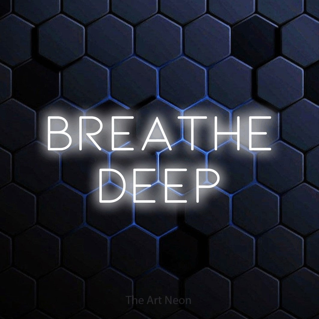 Cool white LED neon sign reading "Breathe Deep" against a blue hexagonal wall