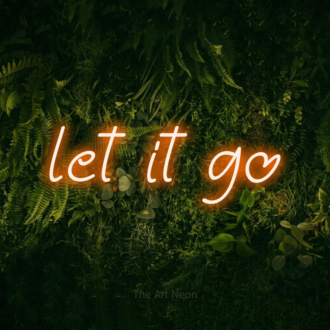 Orange LED neon sign reading "Let It Go" against a moss-covered green wall