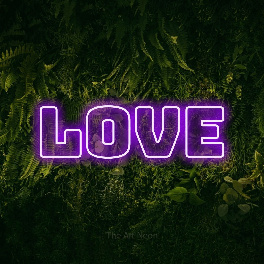 Purple outline-style LED neon sign reading "Love" against a moss-covered green wall