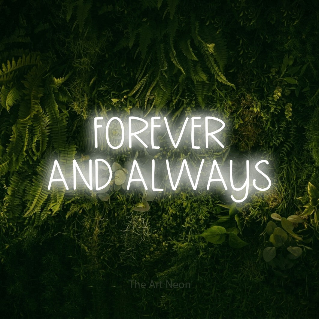 Cool white LED neon sign reading "Forever and Always" against a moss-covered green wall