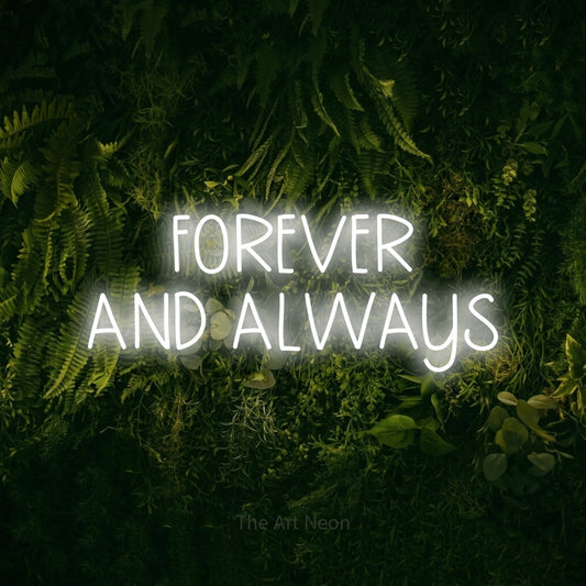 Cool white LED neon sign reading "Forever and Always" against a moss-covered green wall