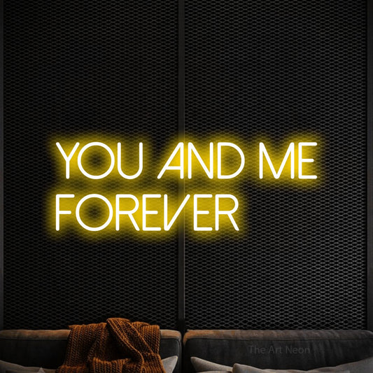 Yellow LED neon sign reading "You and Me Forever" against a black textured wall