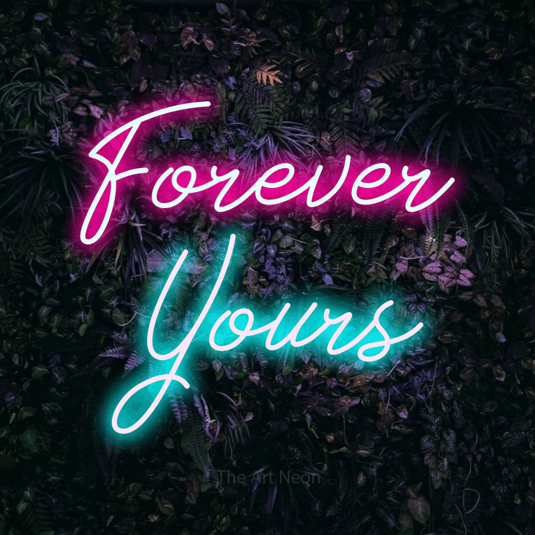 Ice blue and hot pink script-style LED neon sign reading "Forever Yours" against a purple floral wall