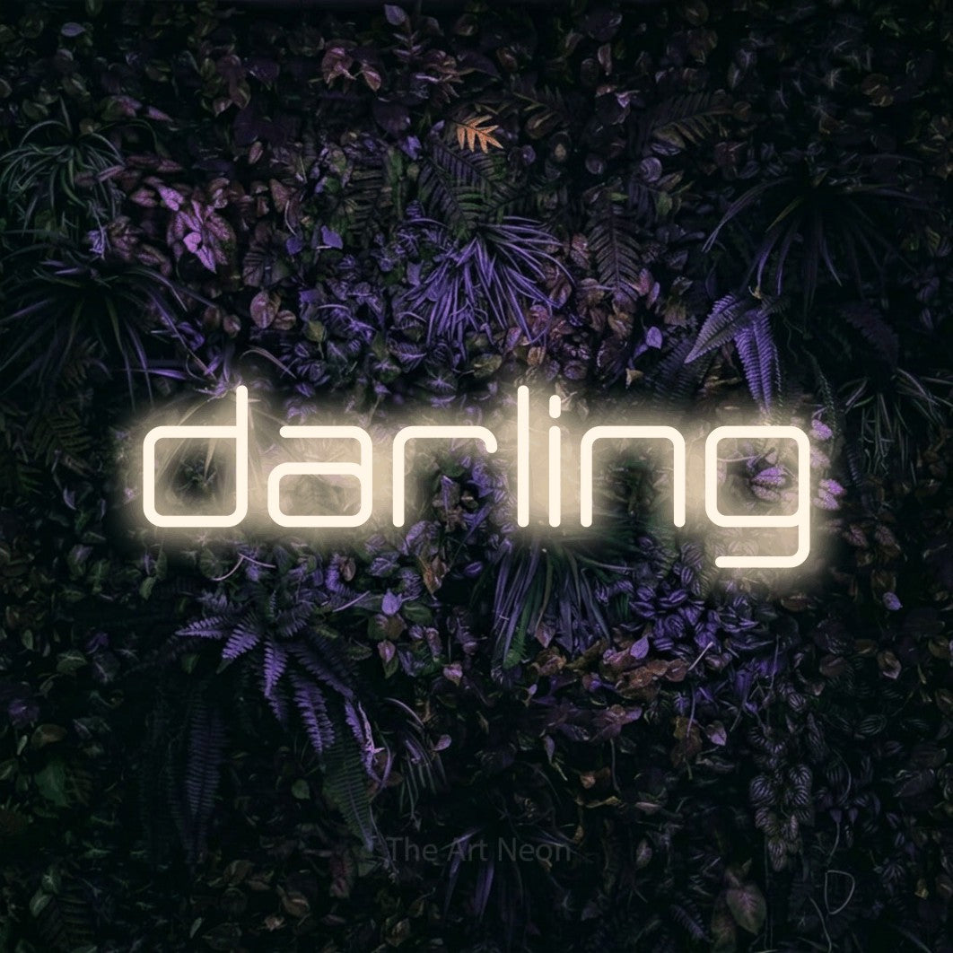 Warm white LED neon sign reading "Darling" against a purple floral wall
