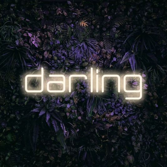 Warm white LED neon sign reading "Darling" against a purple floral wall
