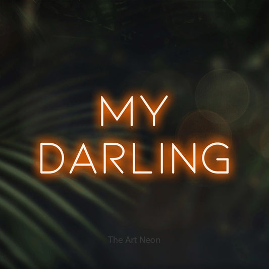 Orange LED neon sign reading "My Darling" against dark blurred palm leaves