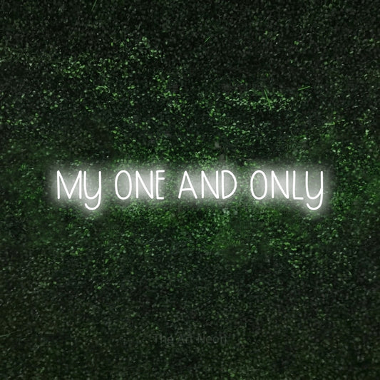 Cool white LED neon sign reading "My One and Only" against a textured green moss wall