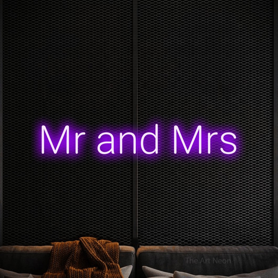Purple LED neon sign reading "Mr and Mrs" against a black textured wall