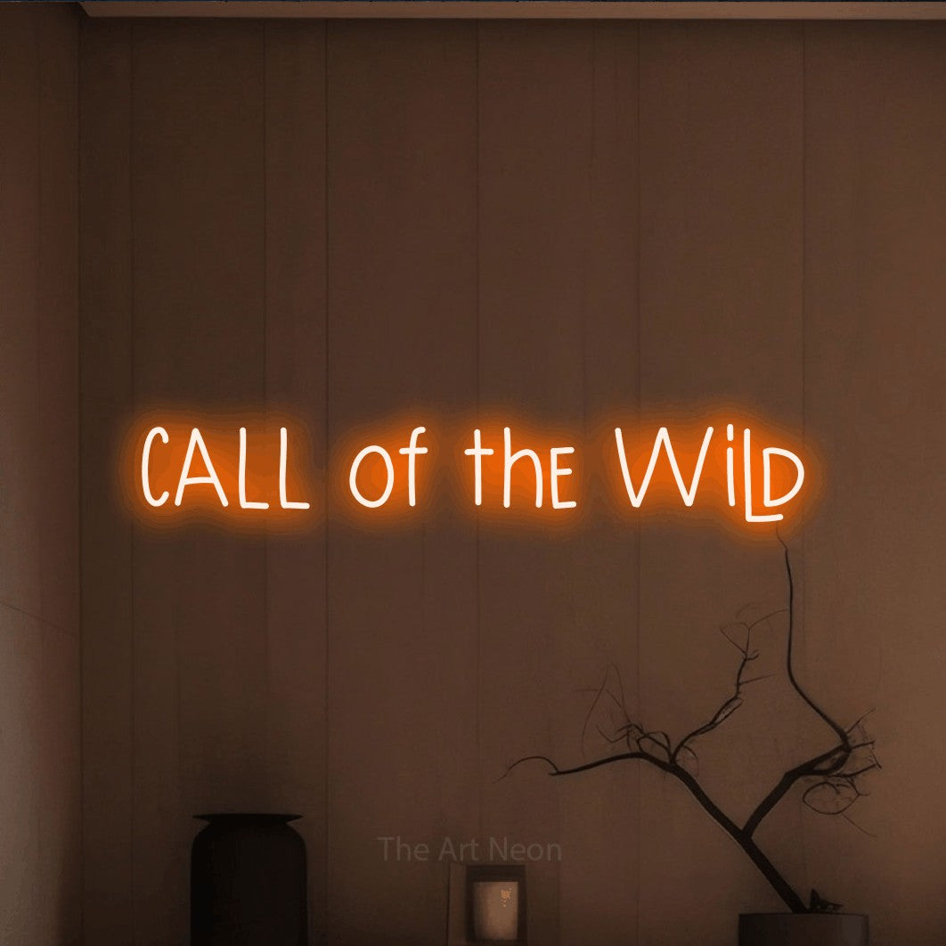 Orange LED neon sign reading "Call of the Wild" against a warm brown wall
