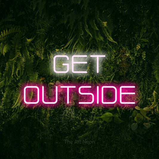 Hot pink and cool white LED neon sign reading "Get Outside" against a moss-covered green wall