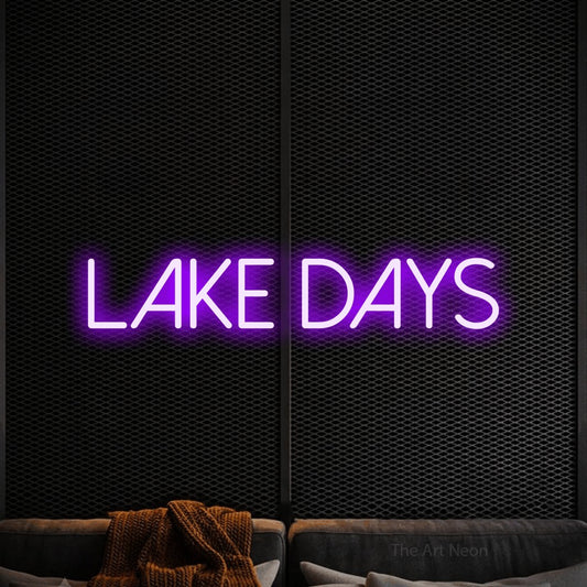 Purple LED neon sign reading "Lake Days" against a black textured wall
