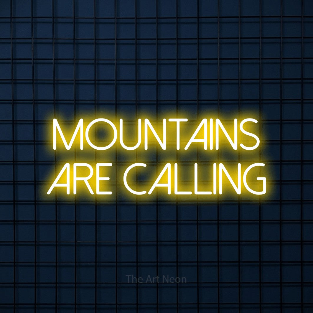 Yellow LED neon sign reading "Mountains Are Calling" against a dark blue tiled wall