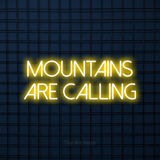 Yellow LED neon sign reading "Mountains Are Calling" against a dark blue tiled wall