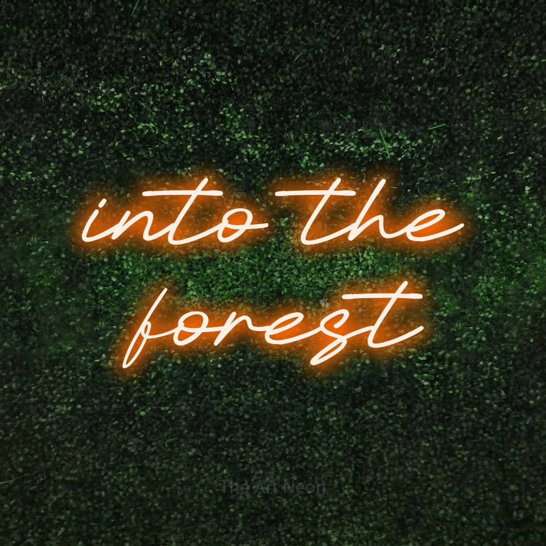 Orange LED neon sign reading "Into the Forest" against a textured green moss wall