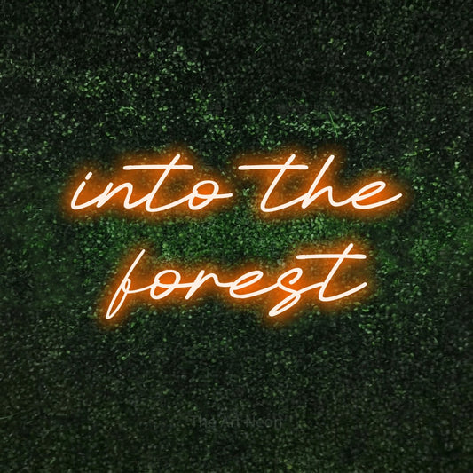 Orange LED neon sign reading "Into the Forest" against a textured green moss wall
