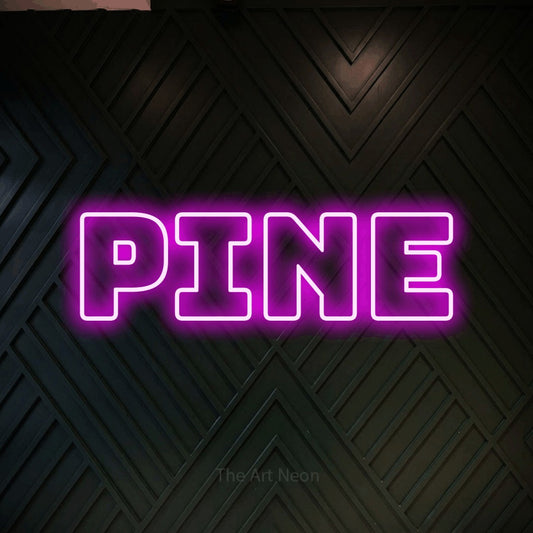 Pink outline-style LED neon sign reading "Pine" against a dark geometric wood wall