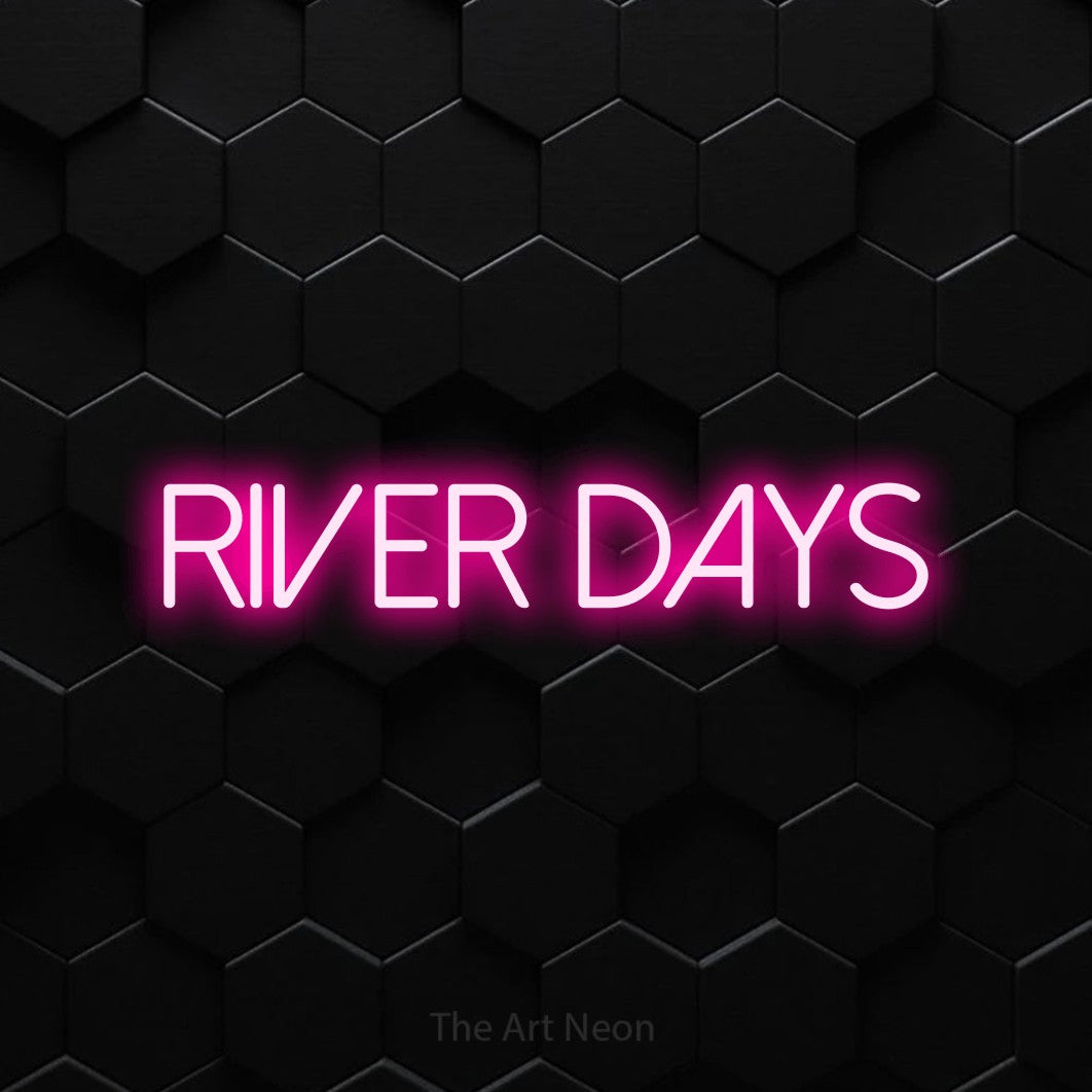Hot pink LED neon sign reading "River Days" against a black hexagonal wall