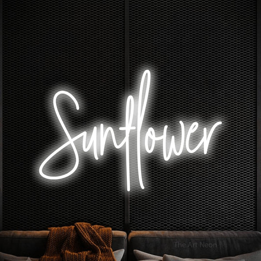 Cool white script-style LED neon sign reading "Sunflower" against a black textured wall