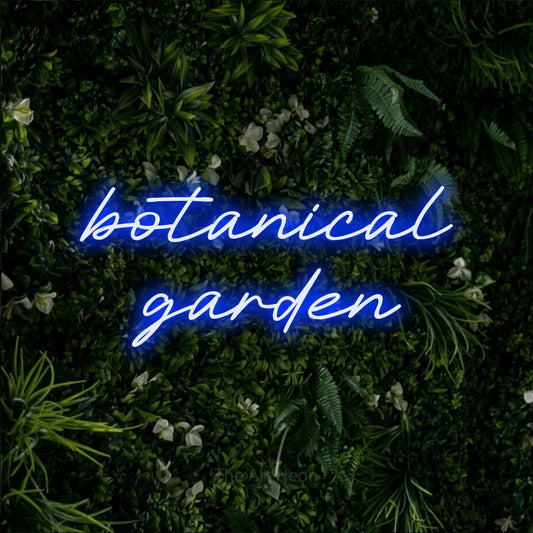 Blue LED neon sign reading "Botanical Garden" against a leafy green wall