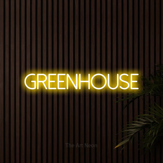 Yellow LED neon sign reading "Greenhouse" against dark wooden slats