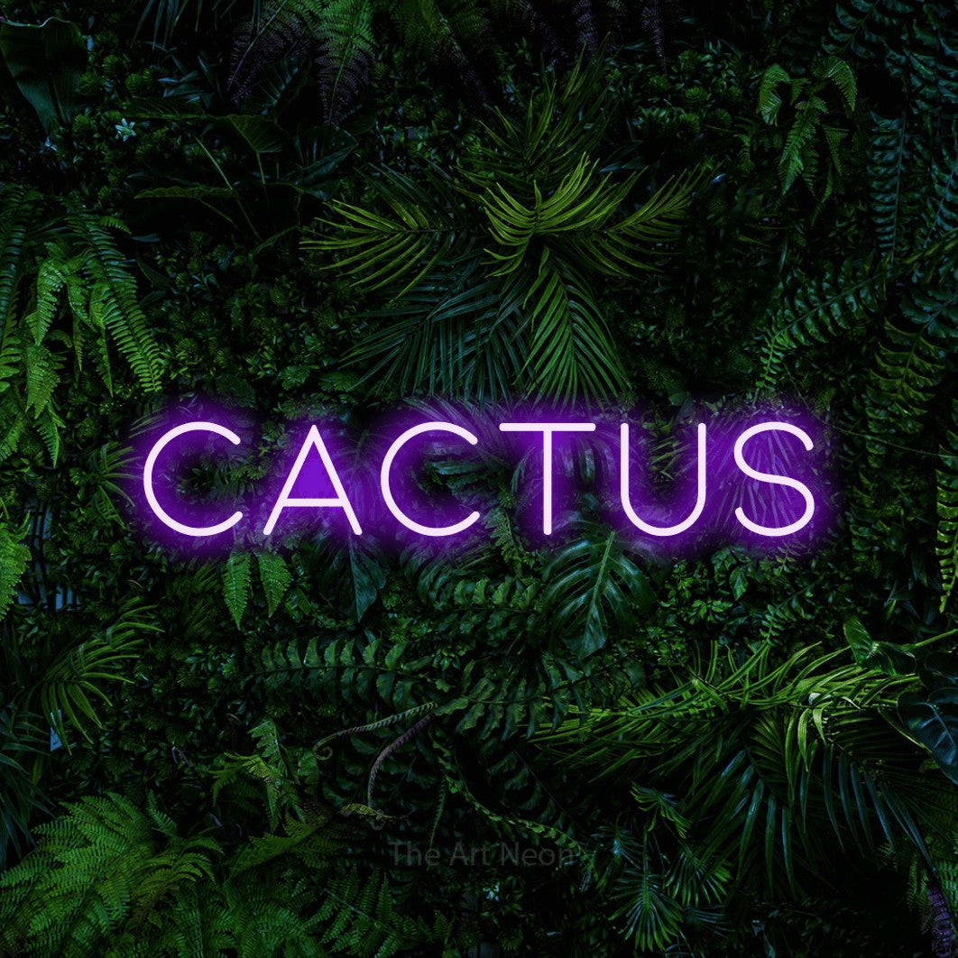 Purple LED neon sign reading "Cactus" against a dense tropical foliage wall