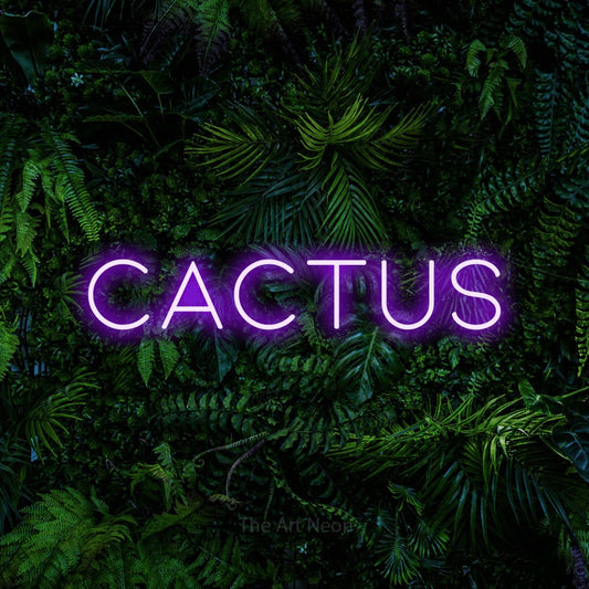 Purple LED neon sign reading "Cactus" against a dense tropical foliage wall