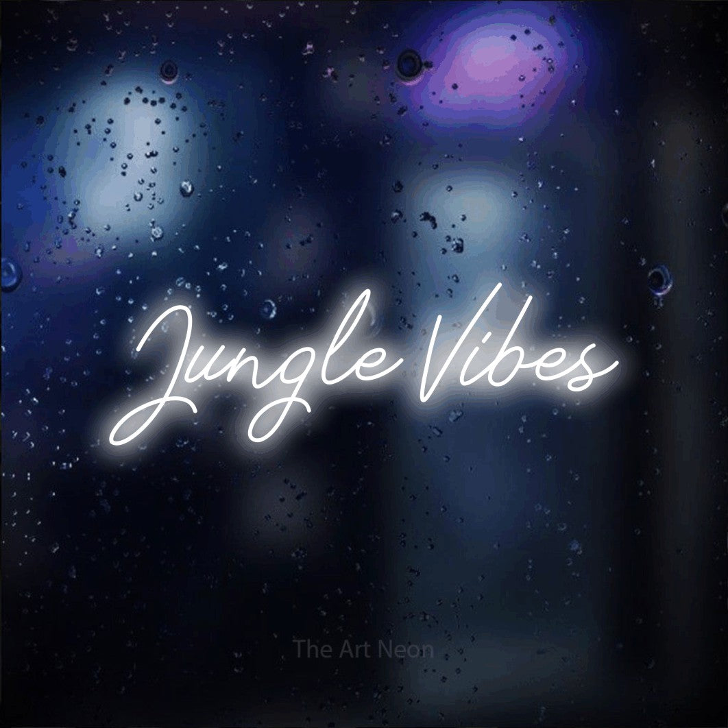 Cool white script-style LED neon sign reading "Jungle Vibes" against a dark blue bokeh background