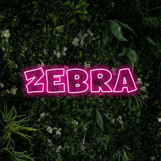 Hot pink outline-style LED neon sign reading "Zebra" against a leafy green wall
