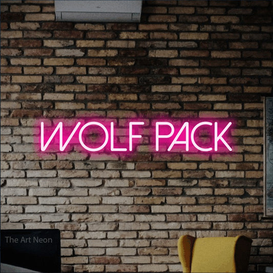 Hot pink LED neon sign reading "Wolf Pack" against a rustic brick wall