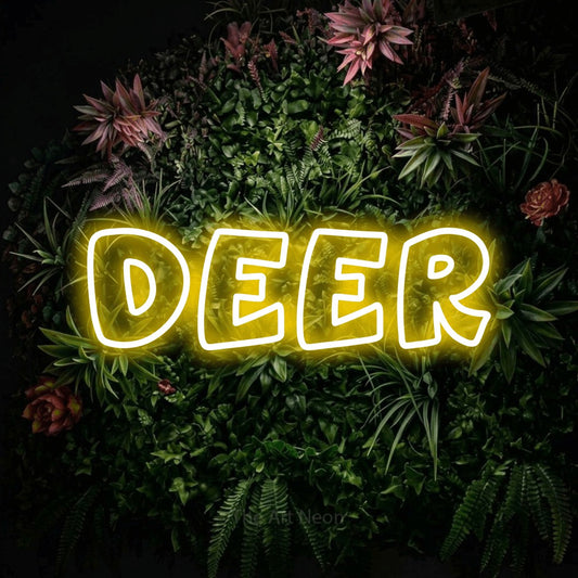 Yellow outline-style LED neon sign reading "Deer" against a flowering garden wall