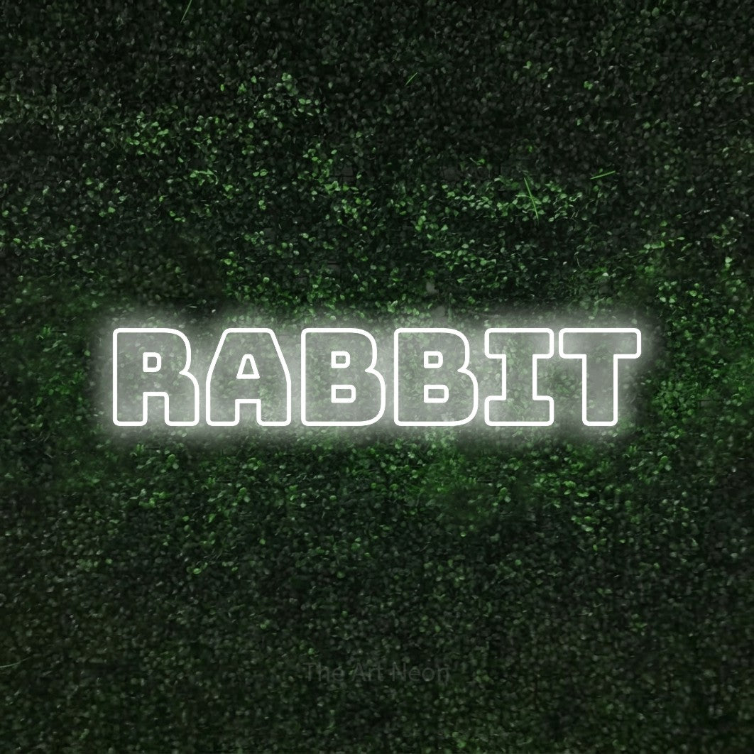 Cool white outline-style LED neon sign reading "Rabbit" against a textured green moss wall