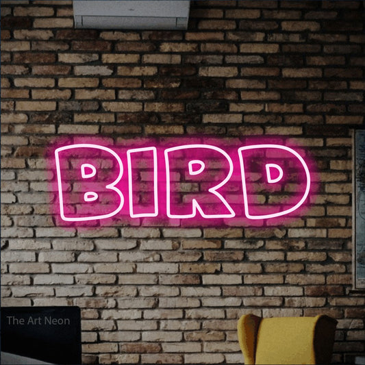 Hot pink outline-style LED neon sign reading "Bird" against a rustic brick wall