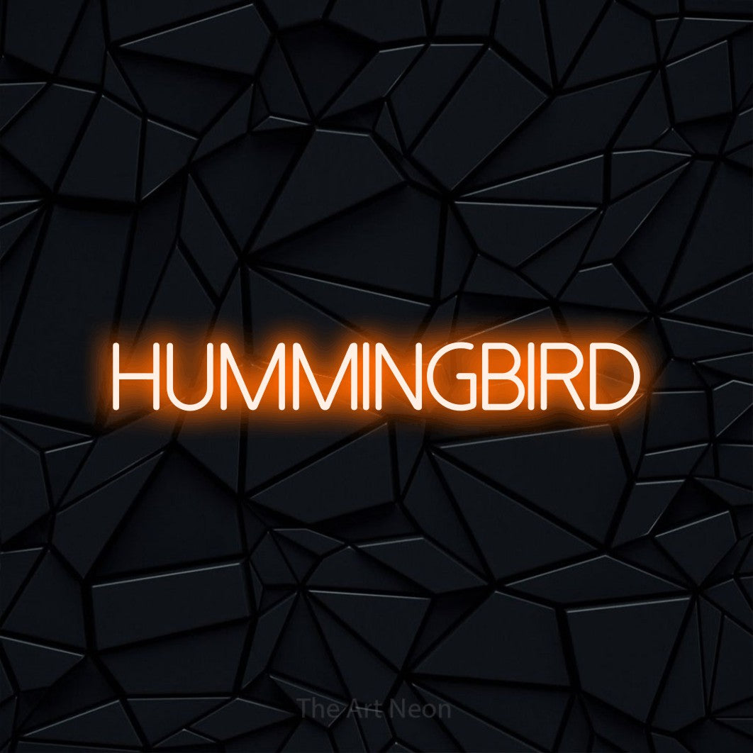 Orange LED neon sign reading "Hummingbird" against a black faceted wall