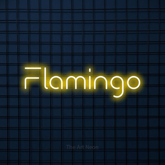 Yellow LED neon sign reading "Flamingo" against a dark blue tiled wall
