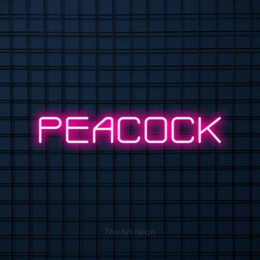 Hot pink outline-style LED neon sign reading "Peacock" against a dark blue tiled wall