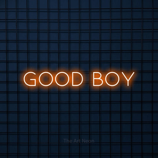 Orange LED neon sign reading "Good Boy" against a dark blue tiled wall