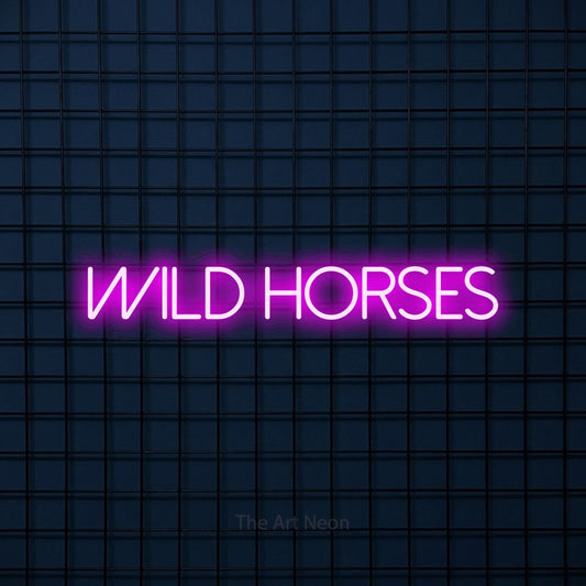 Pink LED neon sign reading "Wild Horses" against a dark blue tiled wall