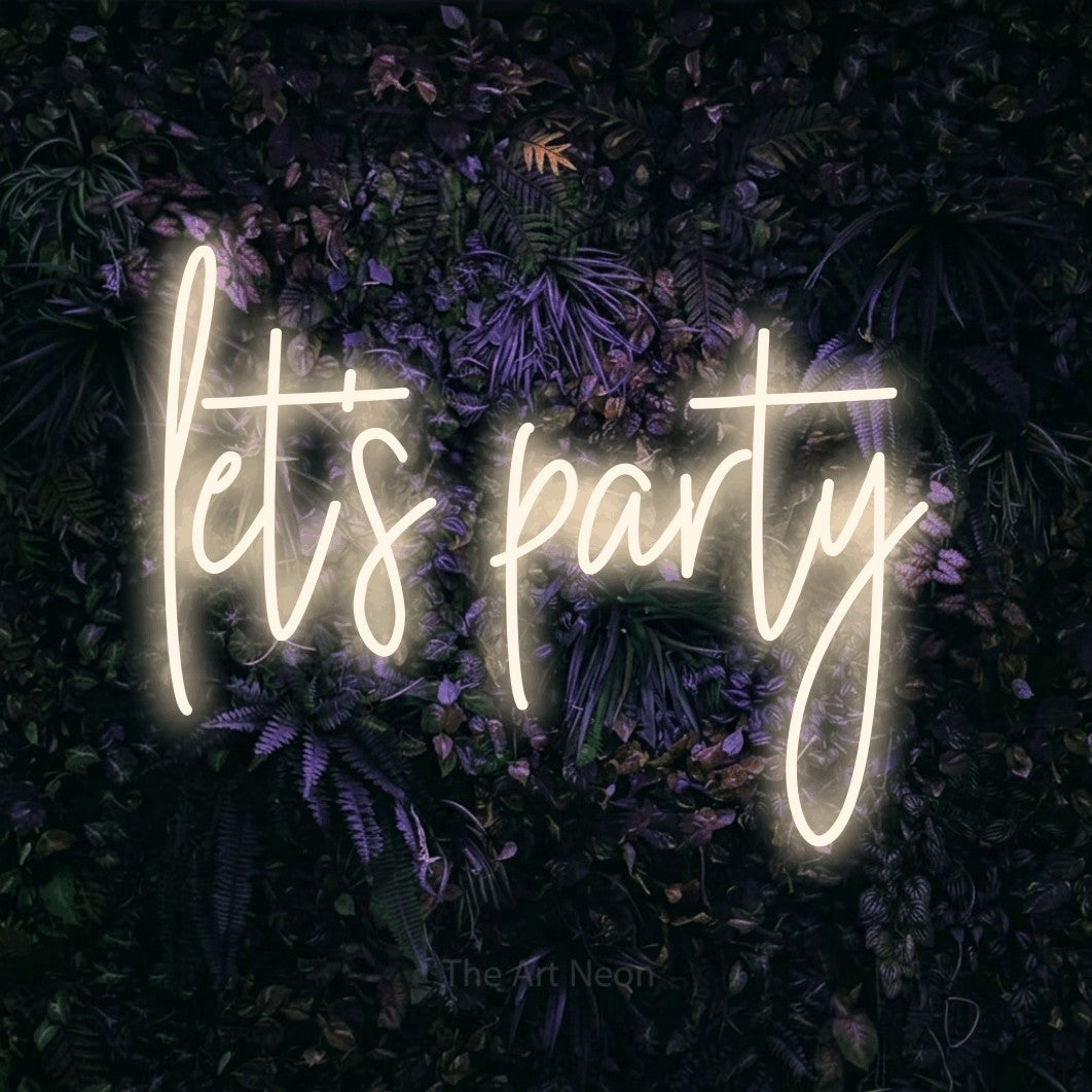 Warm white script-style LED neon sign reading "Let's Party" against a purple floral wall for wedding décor
