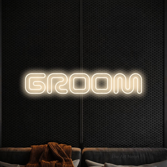 Warm white outline-style LED neon sign reading "Groom" against a black textured wall for wedding décor