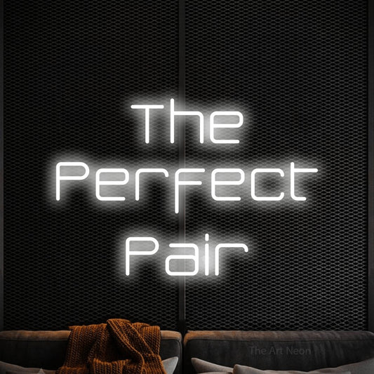 Cool white LED neon sign reading "The Perfect Pair" against a black textured wall for wedding décor